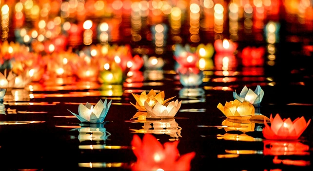 Releasing flower lanterns on the Perfume River